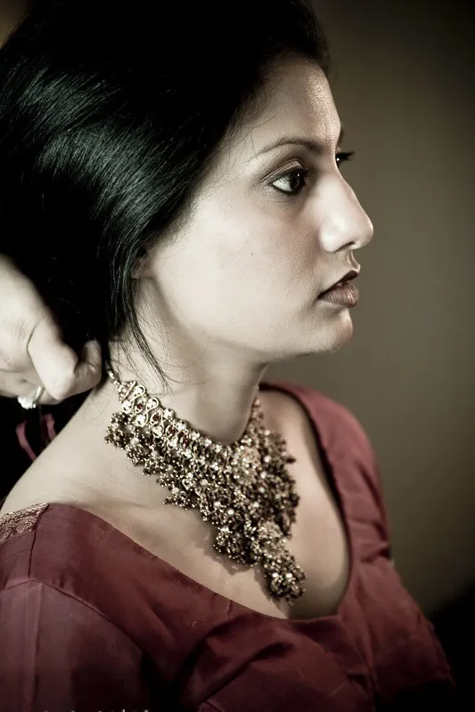 Bridal portrait with traditional jewelry and professional wedding makeup
